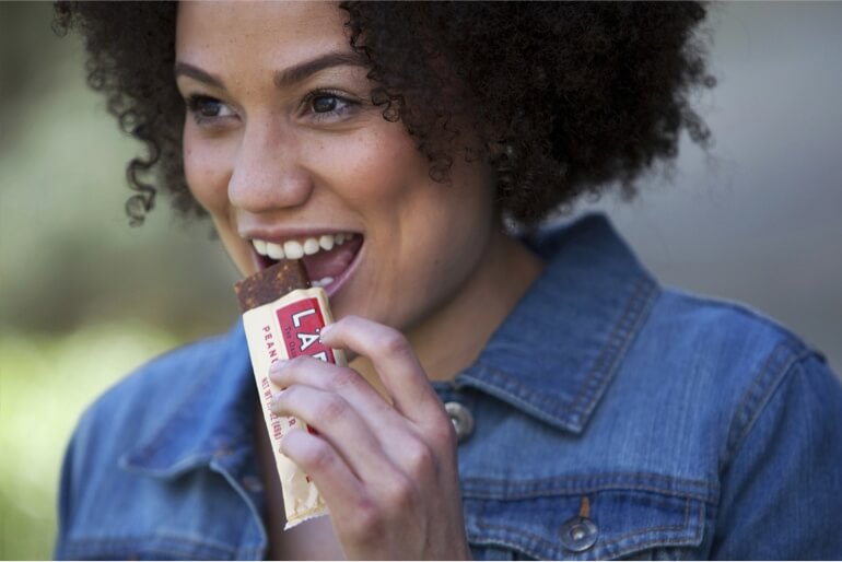 woman eating a Larabar